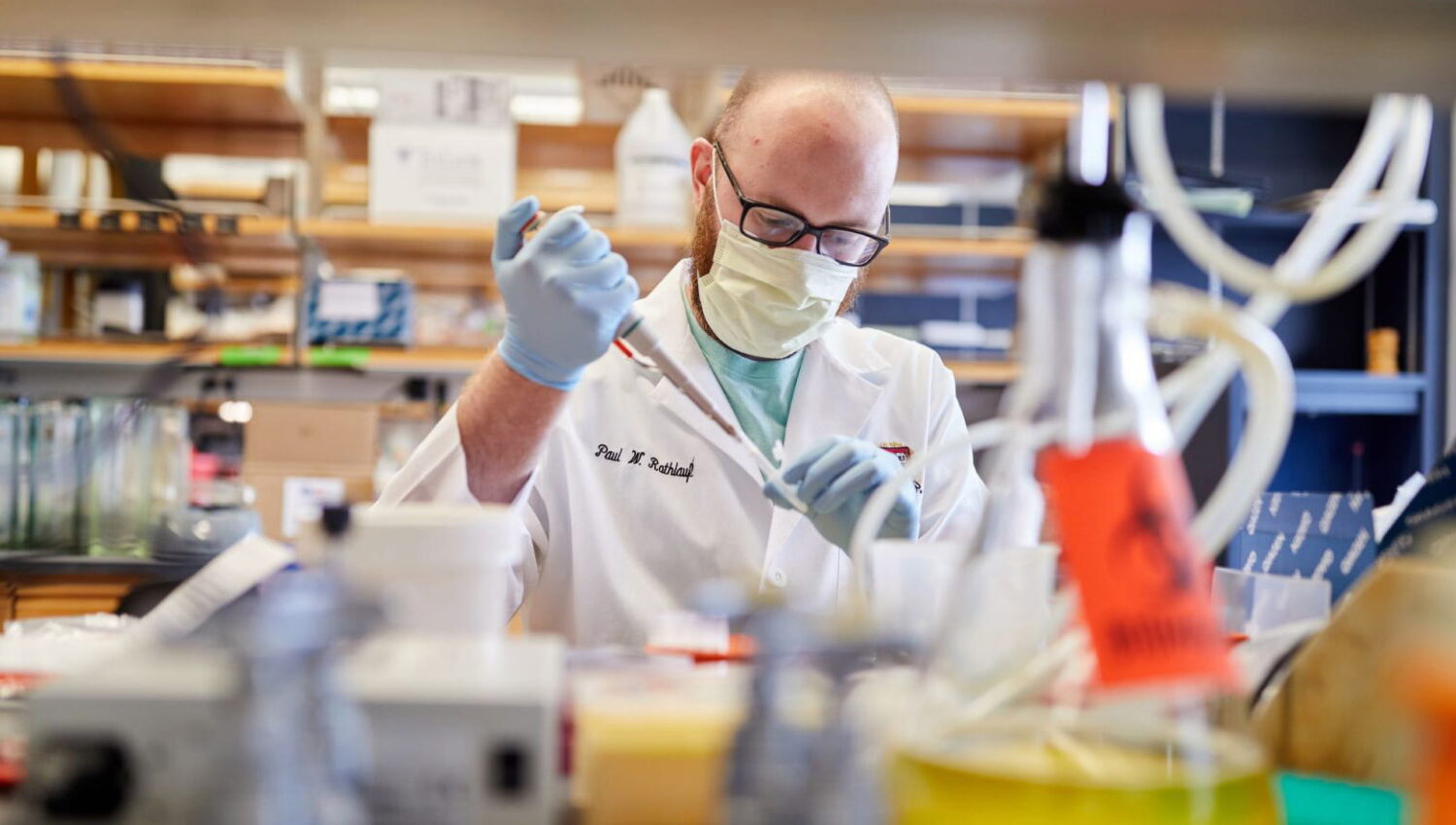 Visiting scientist working in a coronavirus research laboratory