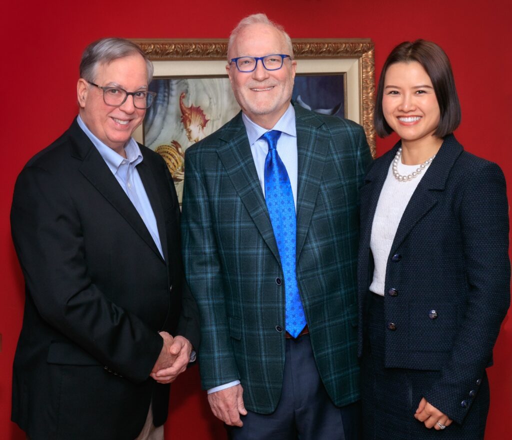 Russ Hornsby, center, and Sherry Hornsby helps Gregory Lanza, MD, PhD, left